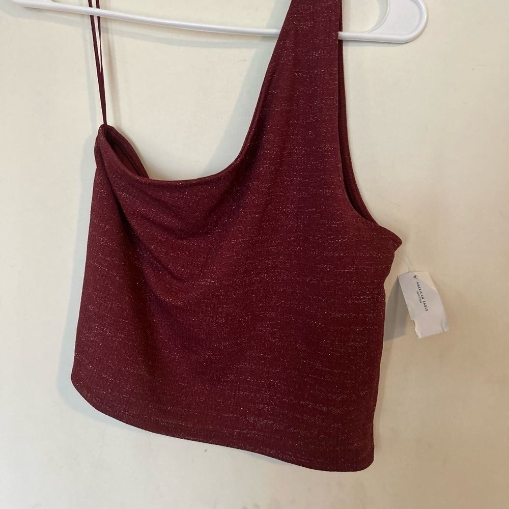 NWT American Eagle
Women's
Sleeveless One Shoulder
Metallic Burgundy Cropped xl
